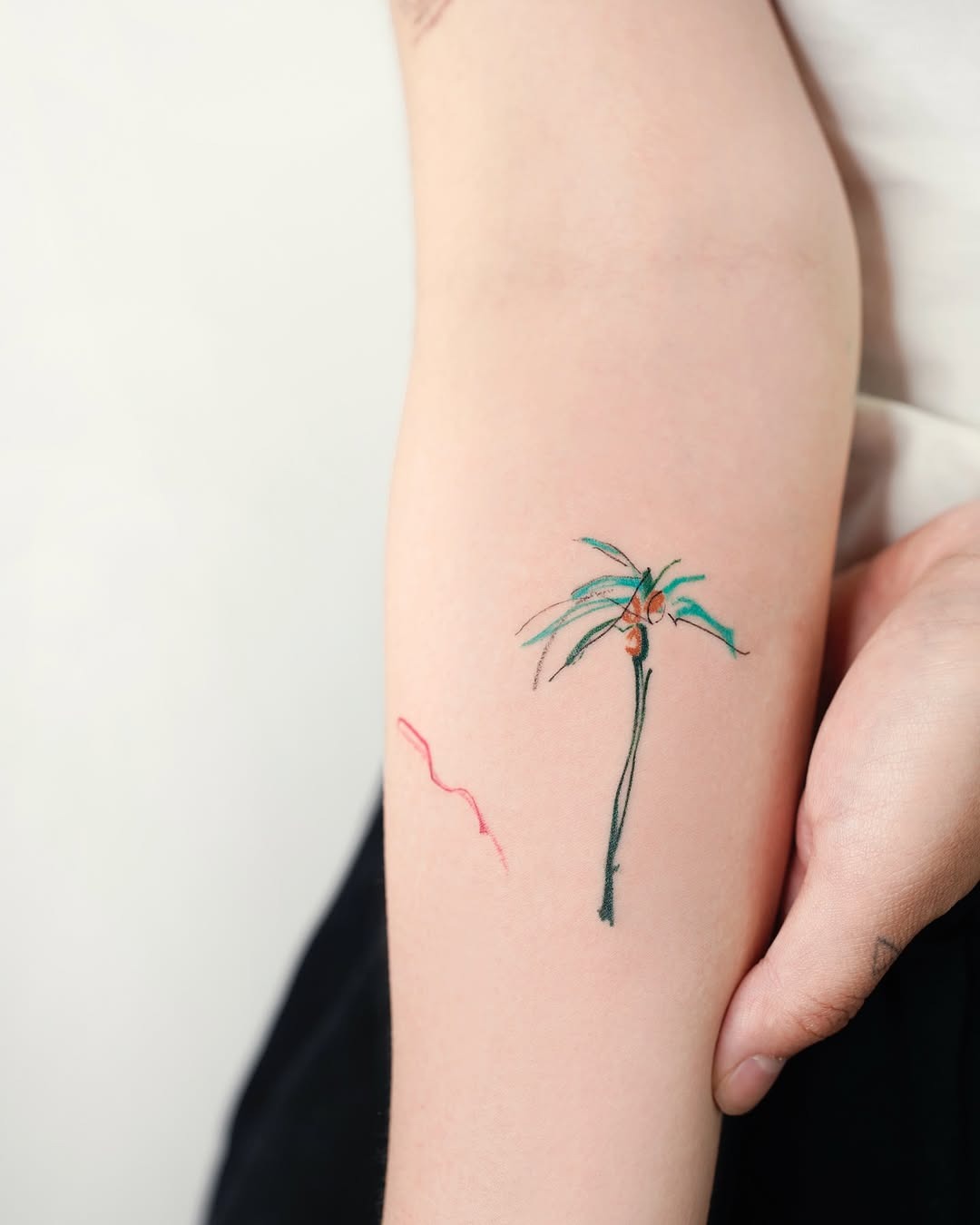 A delicate palm tree tattoo with vibrant colors Tattoo Design