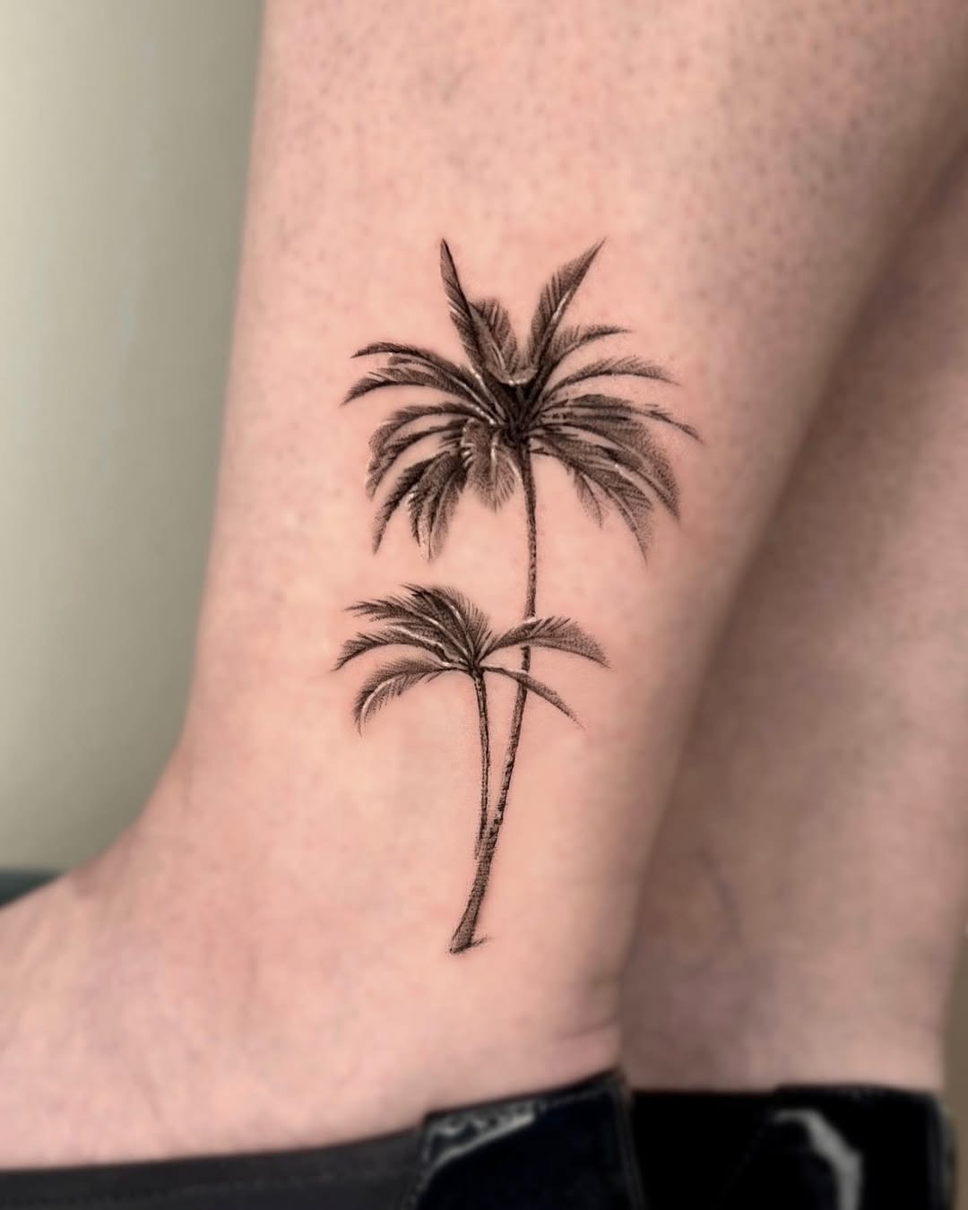 Elegant palm tree tattoo for a tropical vibe Tattoo Design