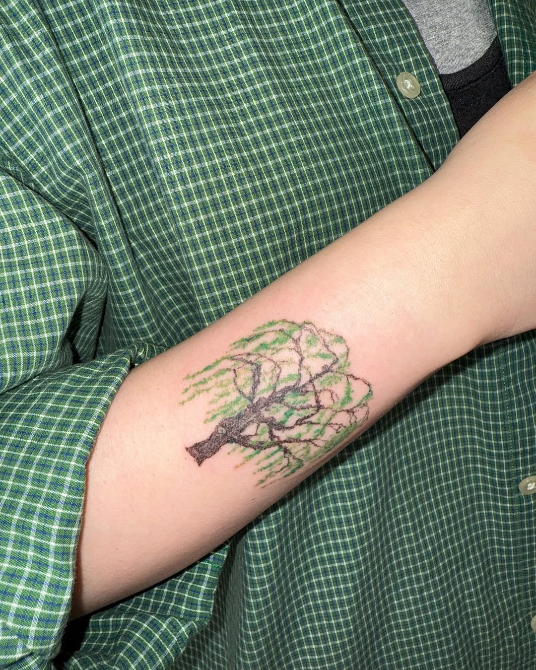 Nature-inspired tree tattoo gracefully displayed on arm Tattoo Design