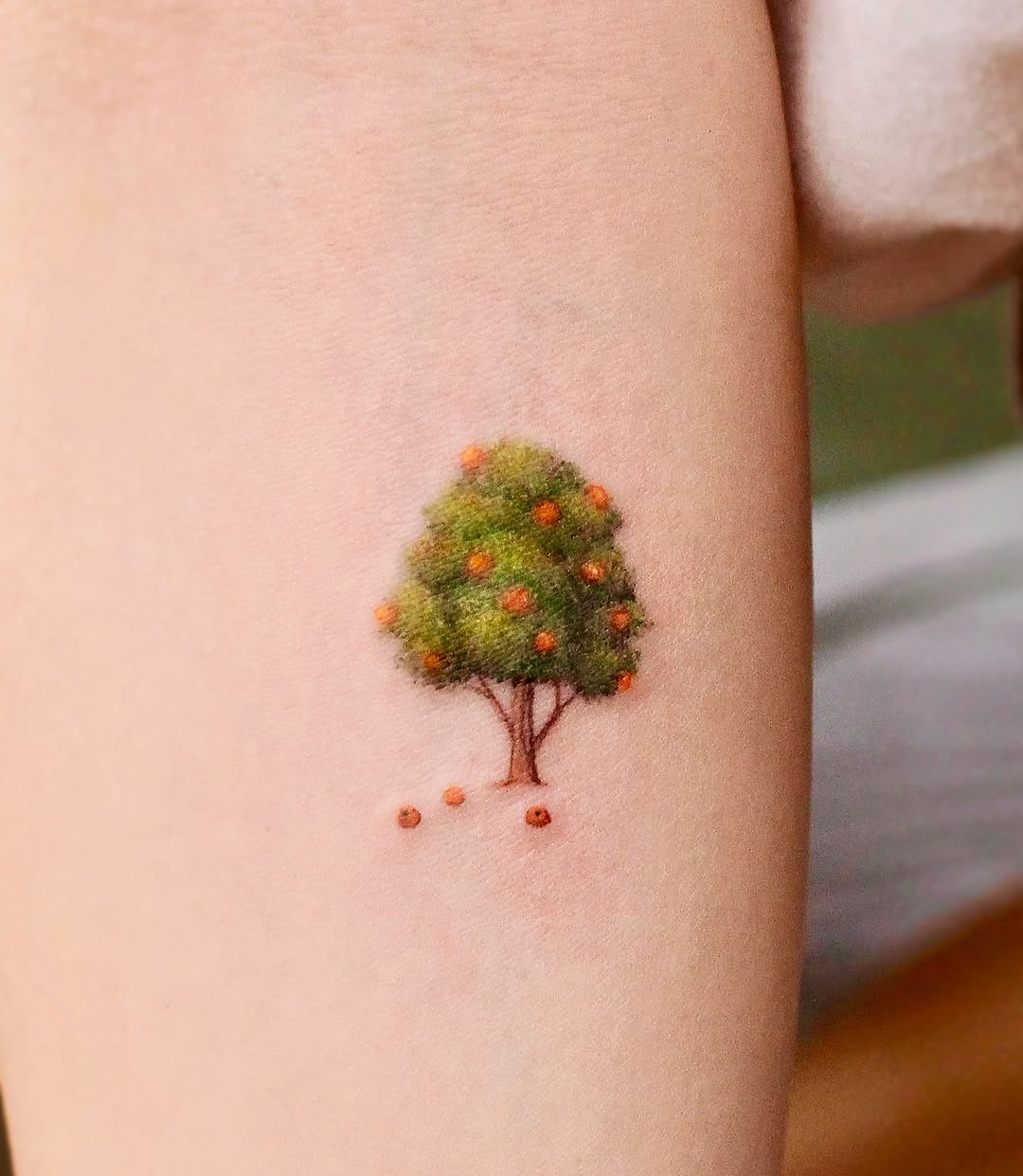 Nature-inspired tree tattoo showcasing vibrant greens Tattoo Design