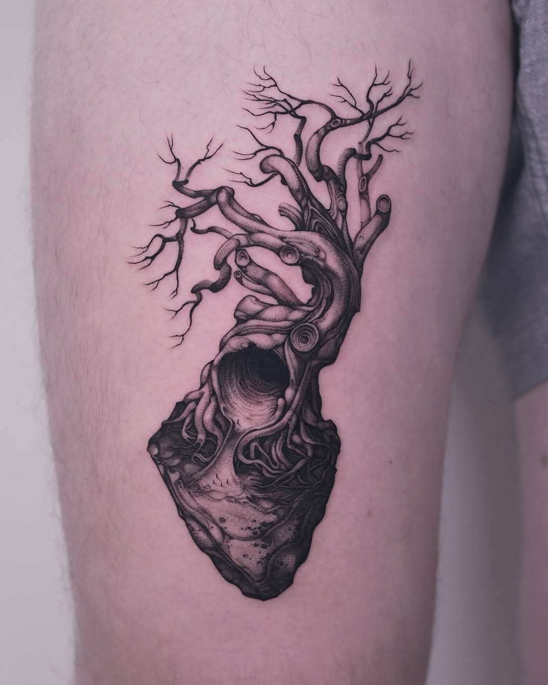 Stunning black ink tree tattoo on thigh Tattoo Design