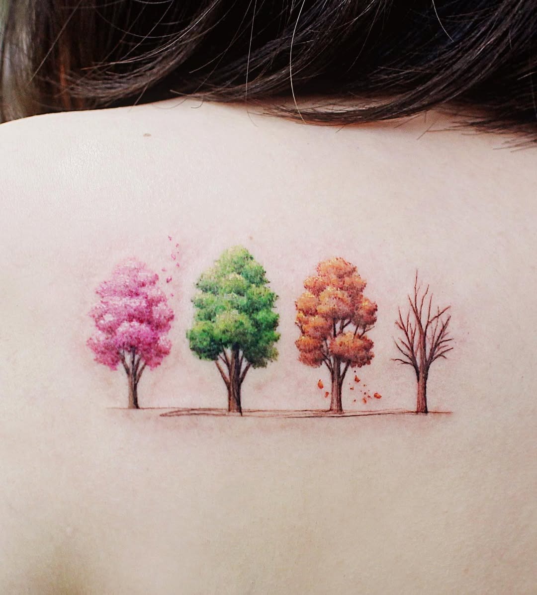 Vibrant seasonal tree tattoo on shoulder Tattoo Design
