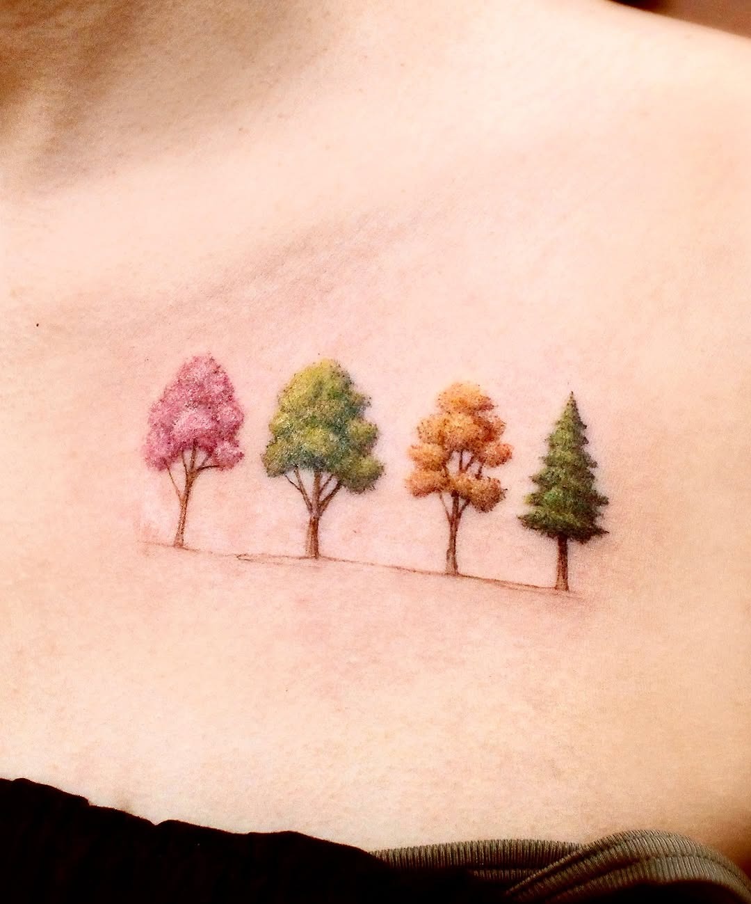 Vibrant tree tattoo showcasing seasonal colors Tattoo Design