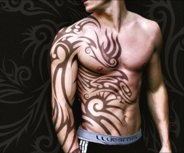 A multi Coloured and very beautiful Tribal Tattoo on a man's arm Tattoo Design