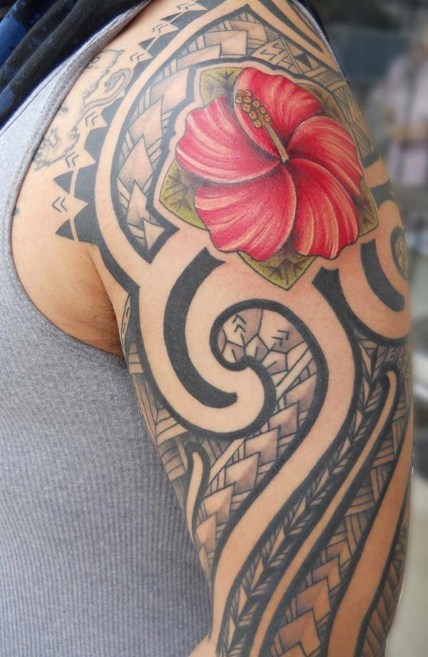A small Tribal Tattoo on a woman's back Tattoo Design
