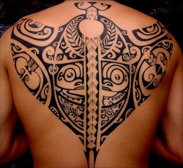 A Tribal Tattoo depicting a carved face Tattoo Design