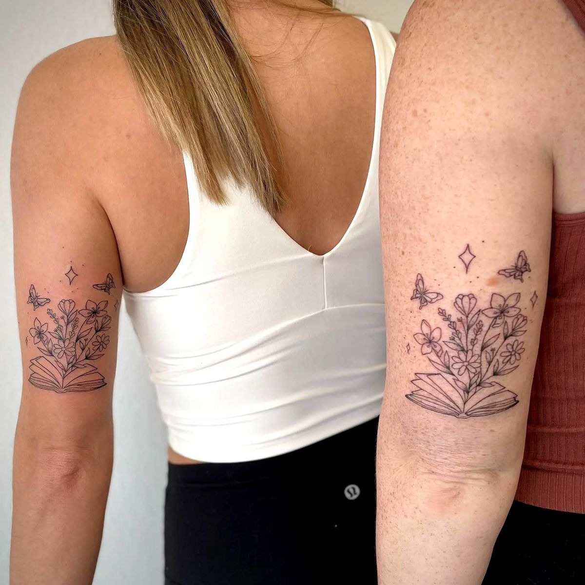 Book + Floral + Butterfly Tricep Tattoo, a tattoo design rendered in clean detailed linework for the arm.