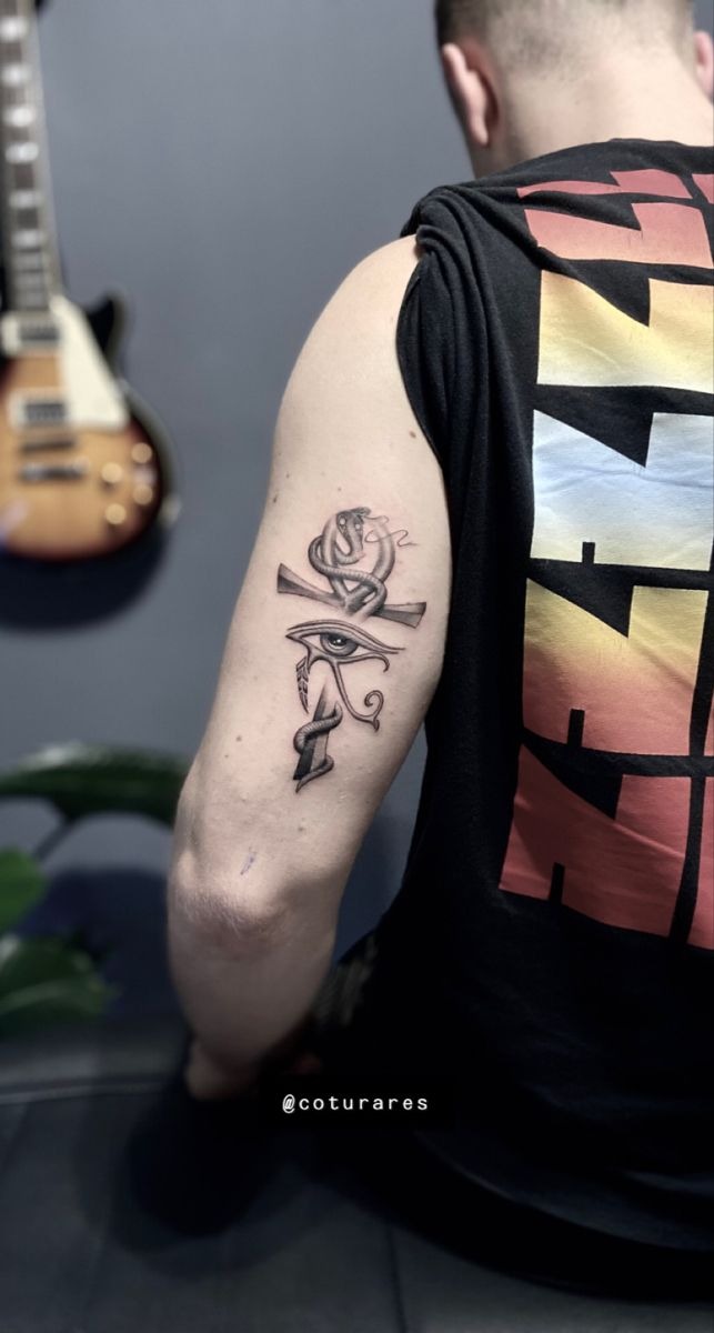 Eye of Horus + Ankh Tricep Tattoo, a tattoo design rendered in clean detailed linework.