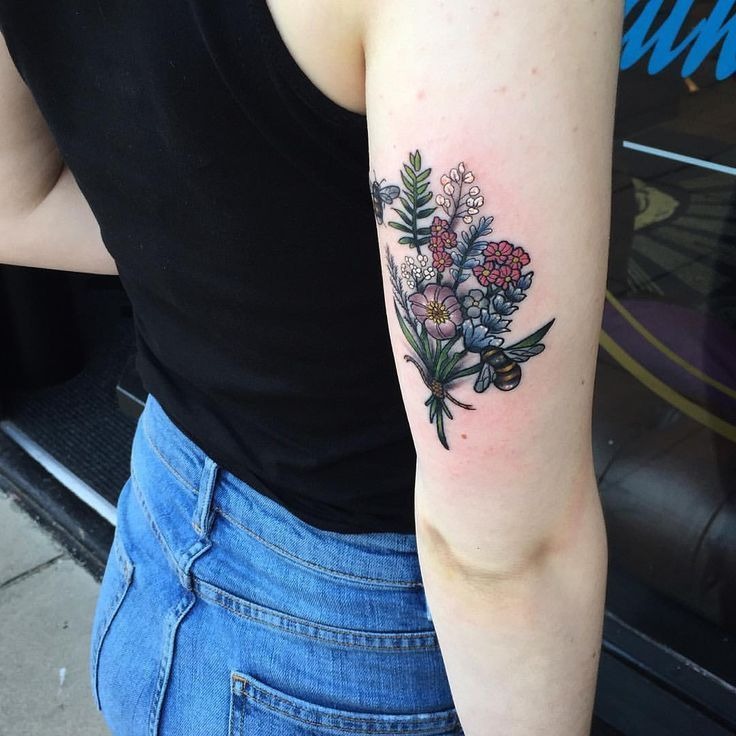 Mini Color Floral Bouquet Tricep Tattoo, a tattoo design rendered in delicate fine-line for the arm.