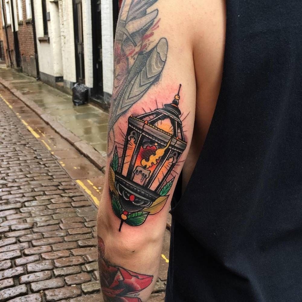 Traditional Lantern Tricep Tattoo, a tattoo design rendered in bold for the arm.
