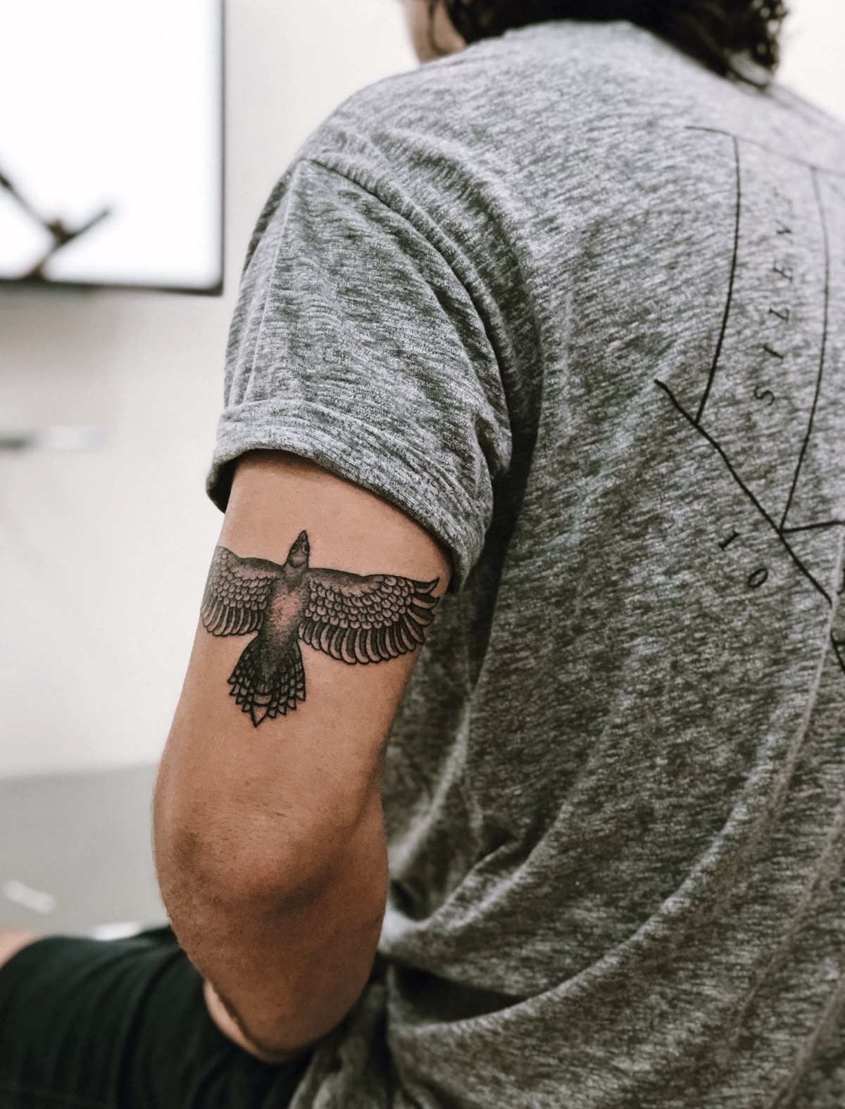 Winged Bird Armband, a tattoo design rendered in bold for the upper arm.