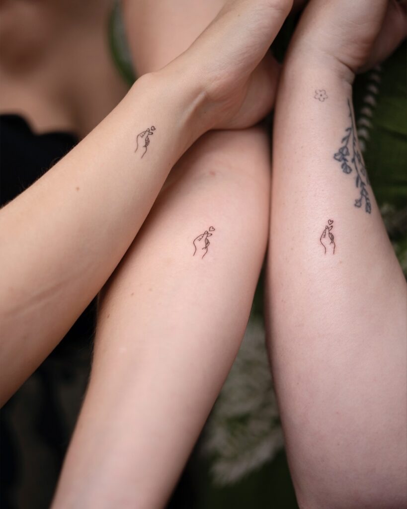 Matching Hand and Heart Trio Tattoo Tattoo Design