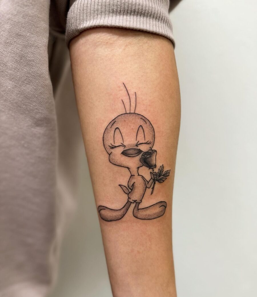 Adorable Tweety Bird Tattoo with a Rose Tattoo Design