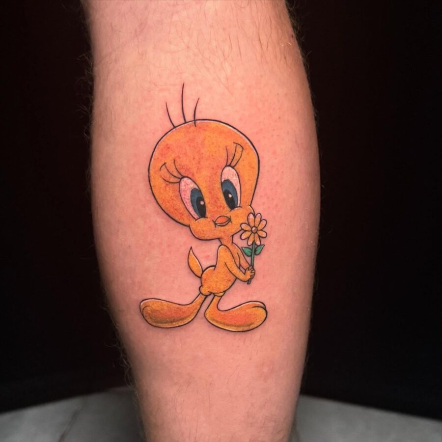 Charming Tweety Tattoo Holding a Flower Tattoo Design