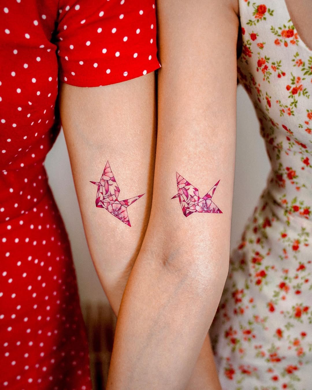 Artistic twin crane tattoos with floral patterns Tattoo Design