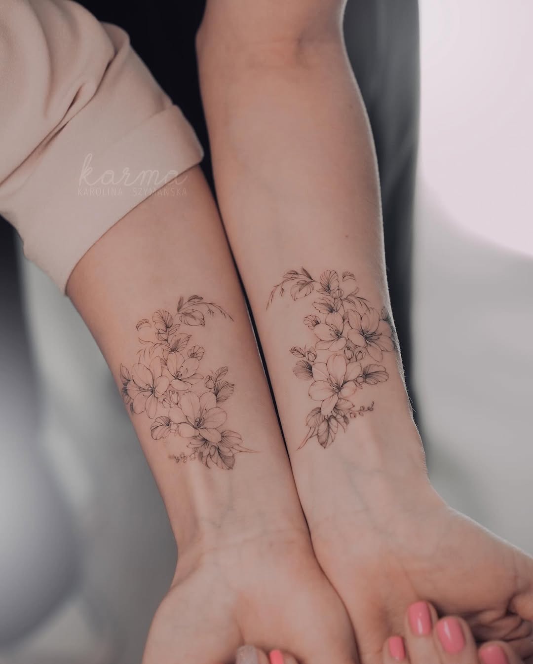 Beautiful twin floral tattoos enhancing sisterly bonds Tattoo Design