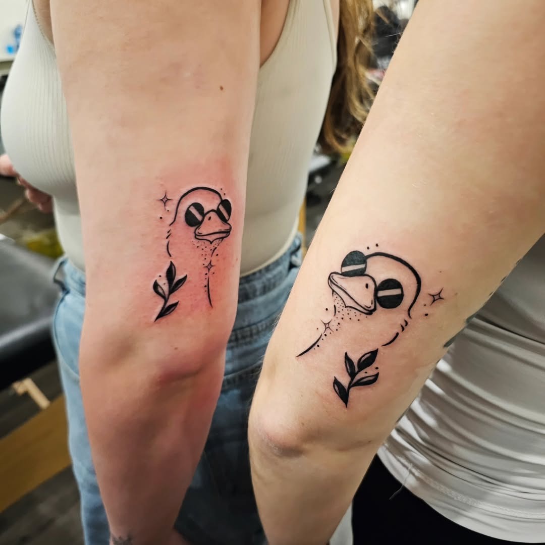 Charming matching duck tattoos for twins Tattoo Design