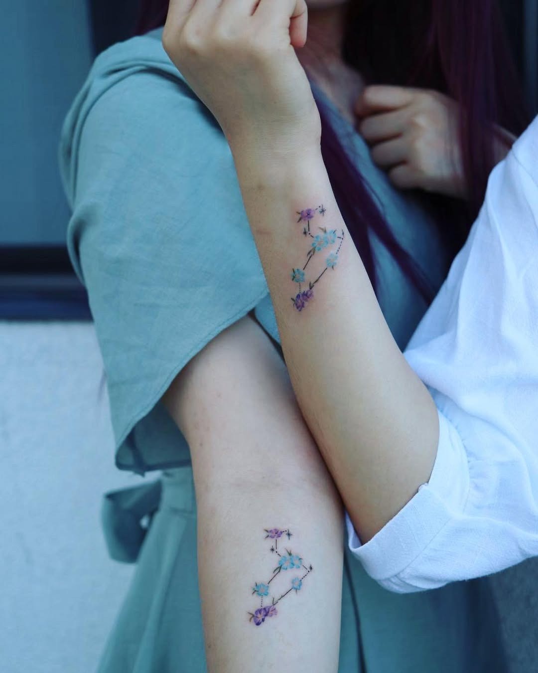 Delicate floral designs celebrating twin connections Tattoo Design