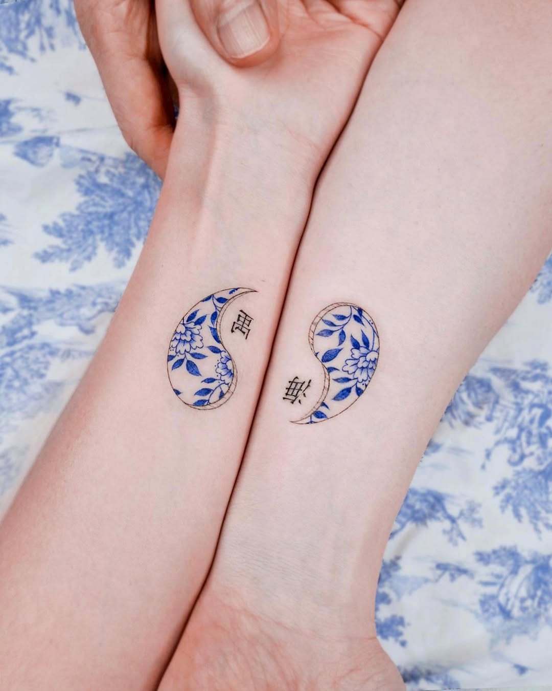 Elegant twin tattoos symbolizing unity and balance Tattoo Design