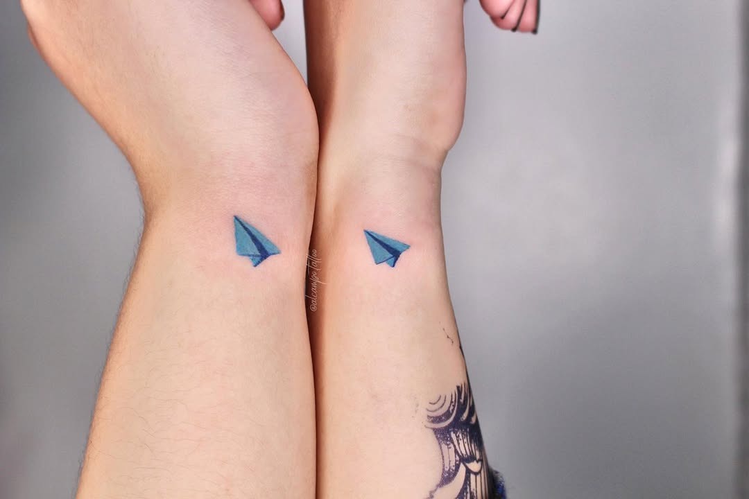 Minimalistic Twin Paper Airplane Tattoos in Blue Tattoo Design