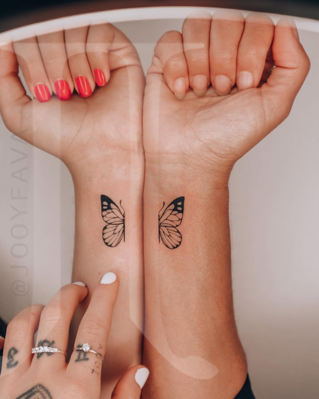 Symbolic twin butterfly tattoos on wrists Tattoo Design
