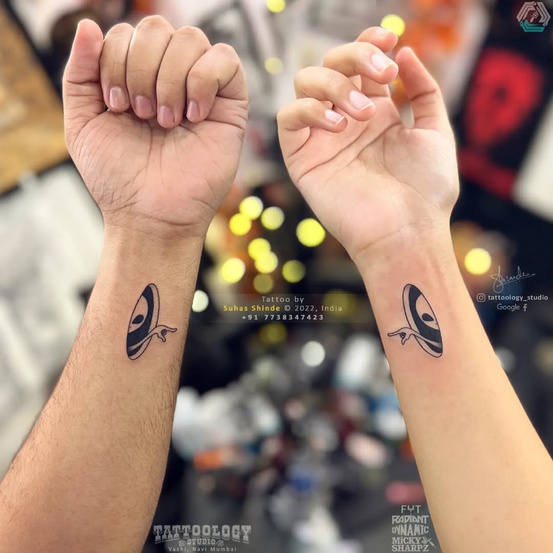 Unique Twin Tattoos with Eye Motif Tattoo Design