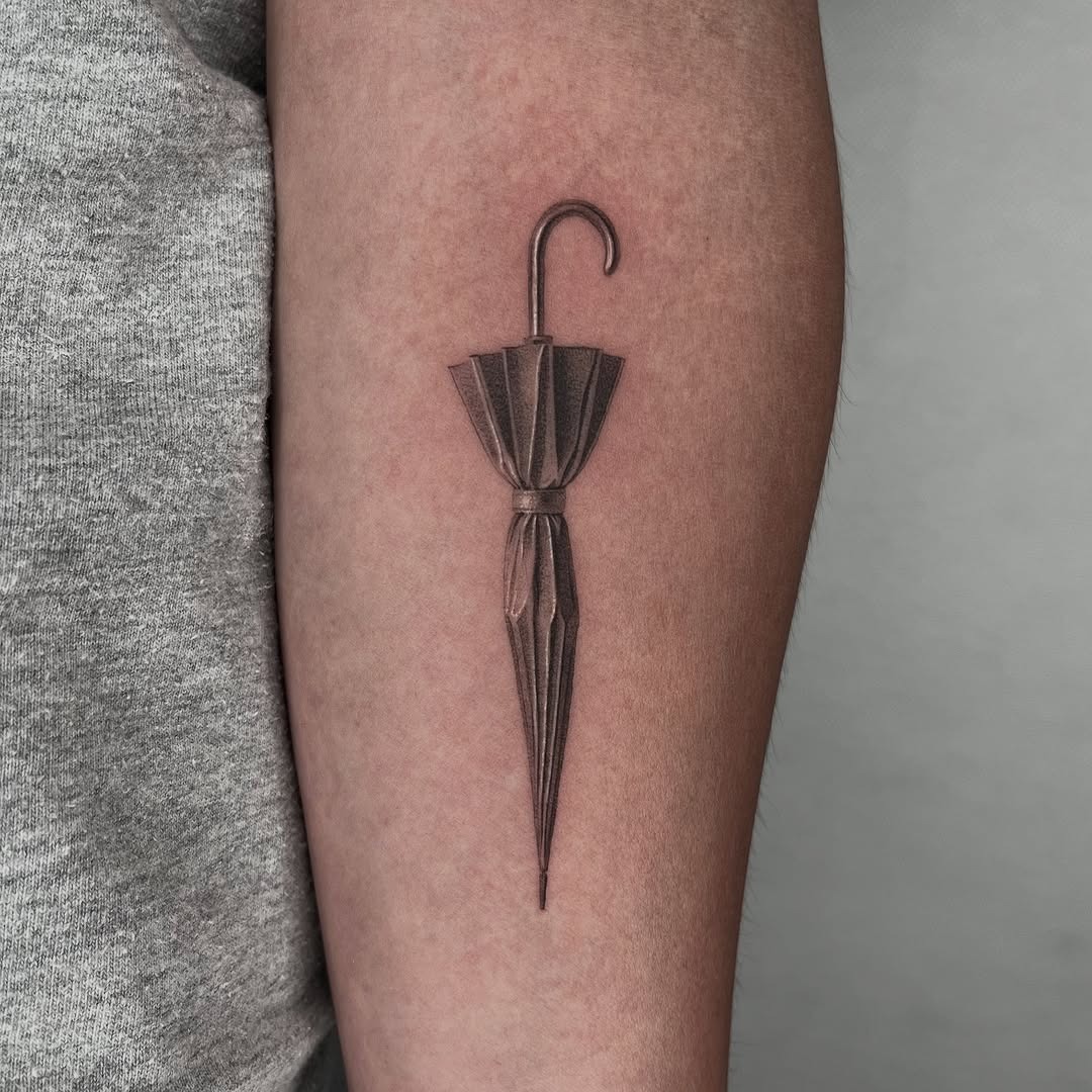 Elegant realistic umbrella tattoo on forearm Tattoo Design