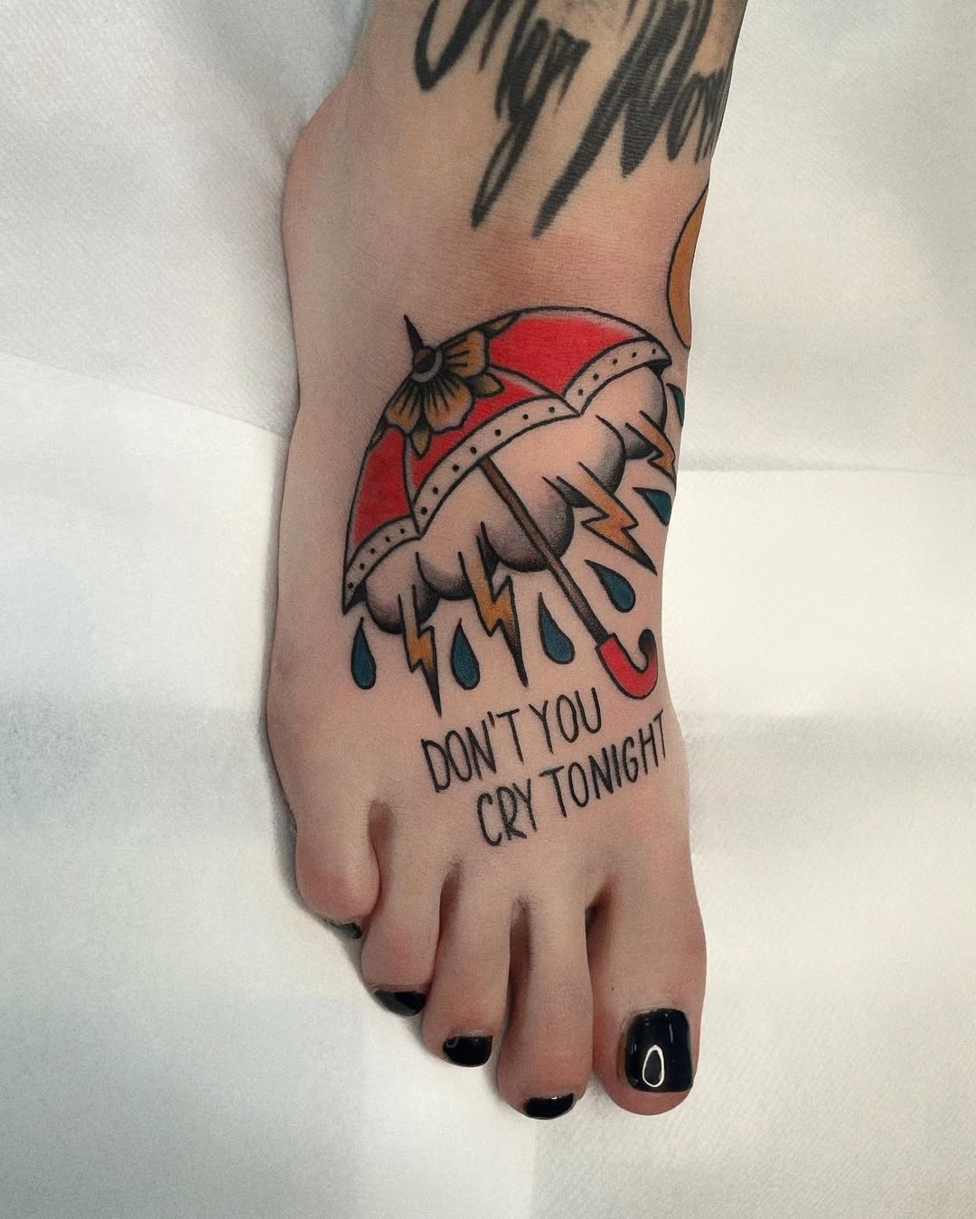 Playful umbrella tattoo with a heartfelt message Tattoo Design