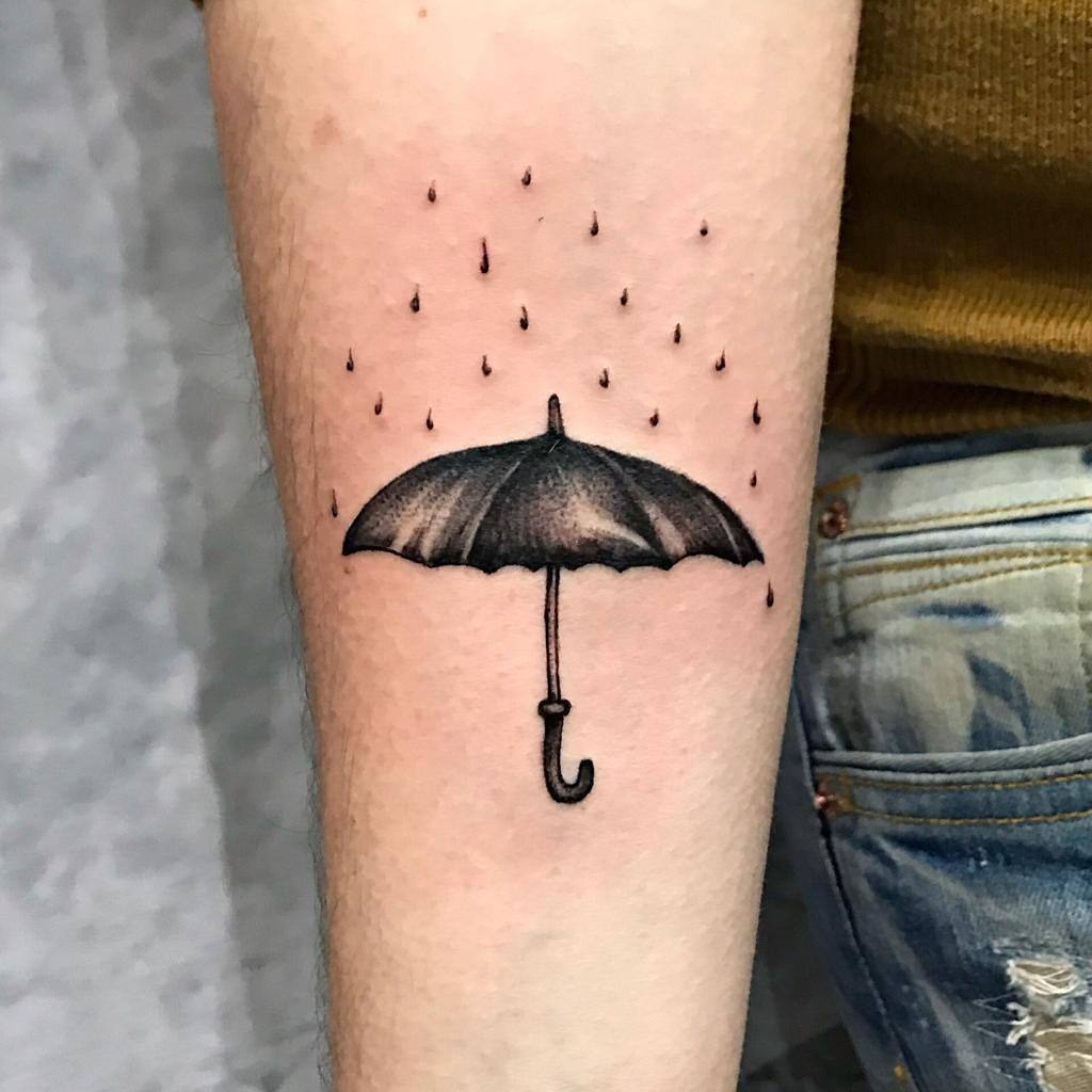 Stylish umbrella tattoo with raindrops design Tattoo Design