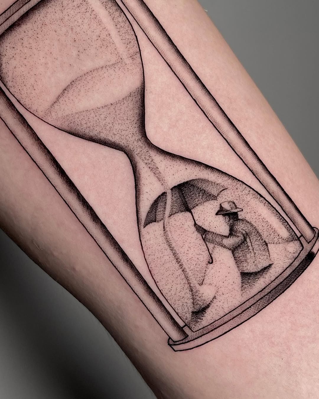 Symbolic umbrella within an hourglass tattoo Tattoo Design