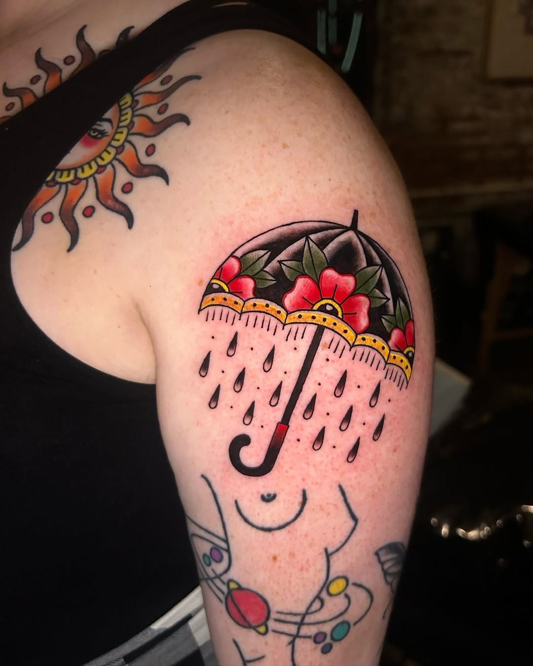 Vibrant umbrella tattoo with floral design Tattoo Design