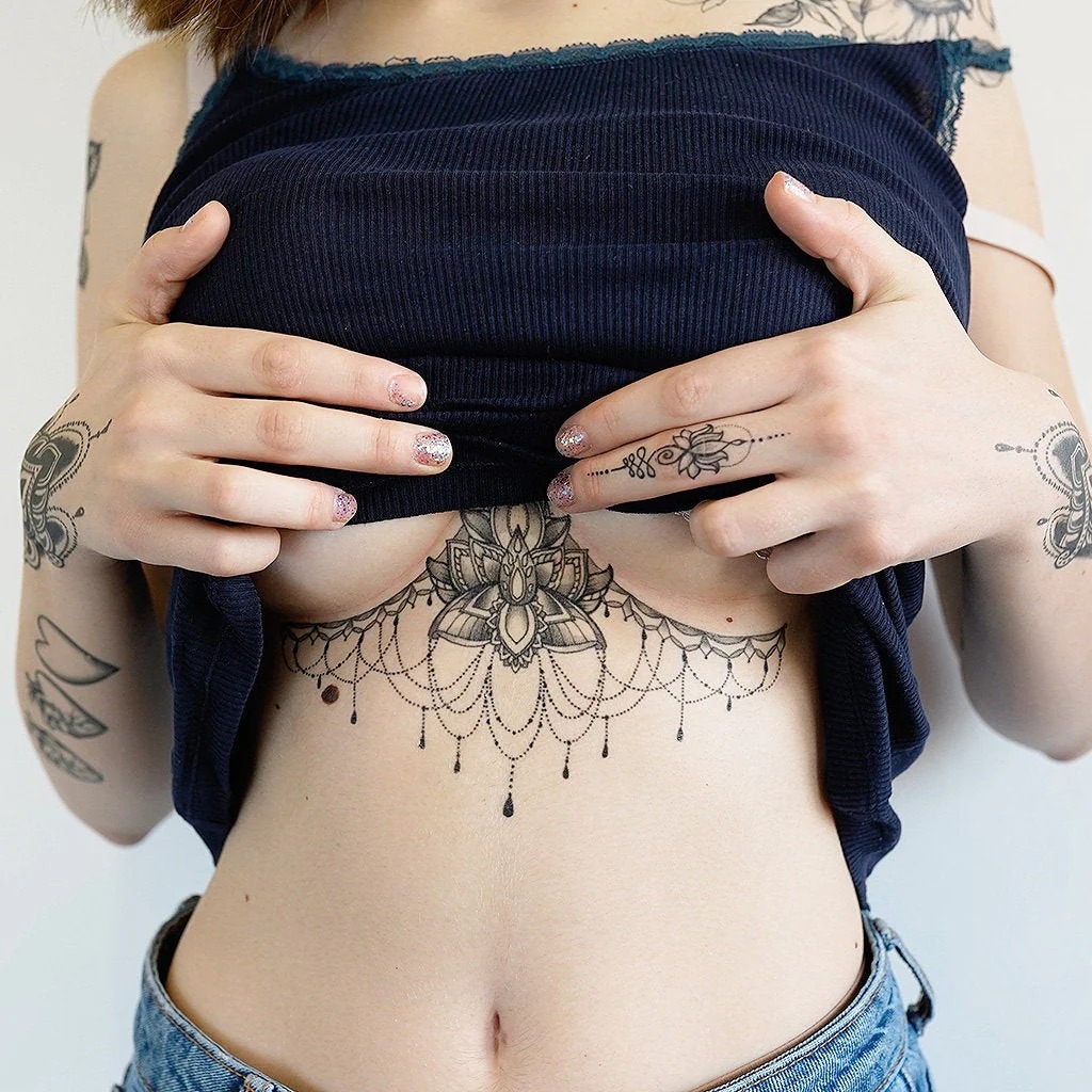 Ornate Floral Design with Dangling Details Tattoo Design