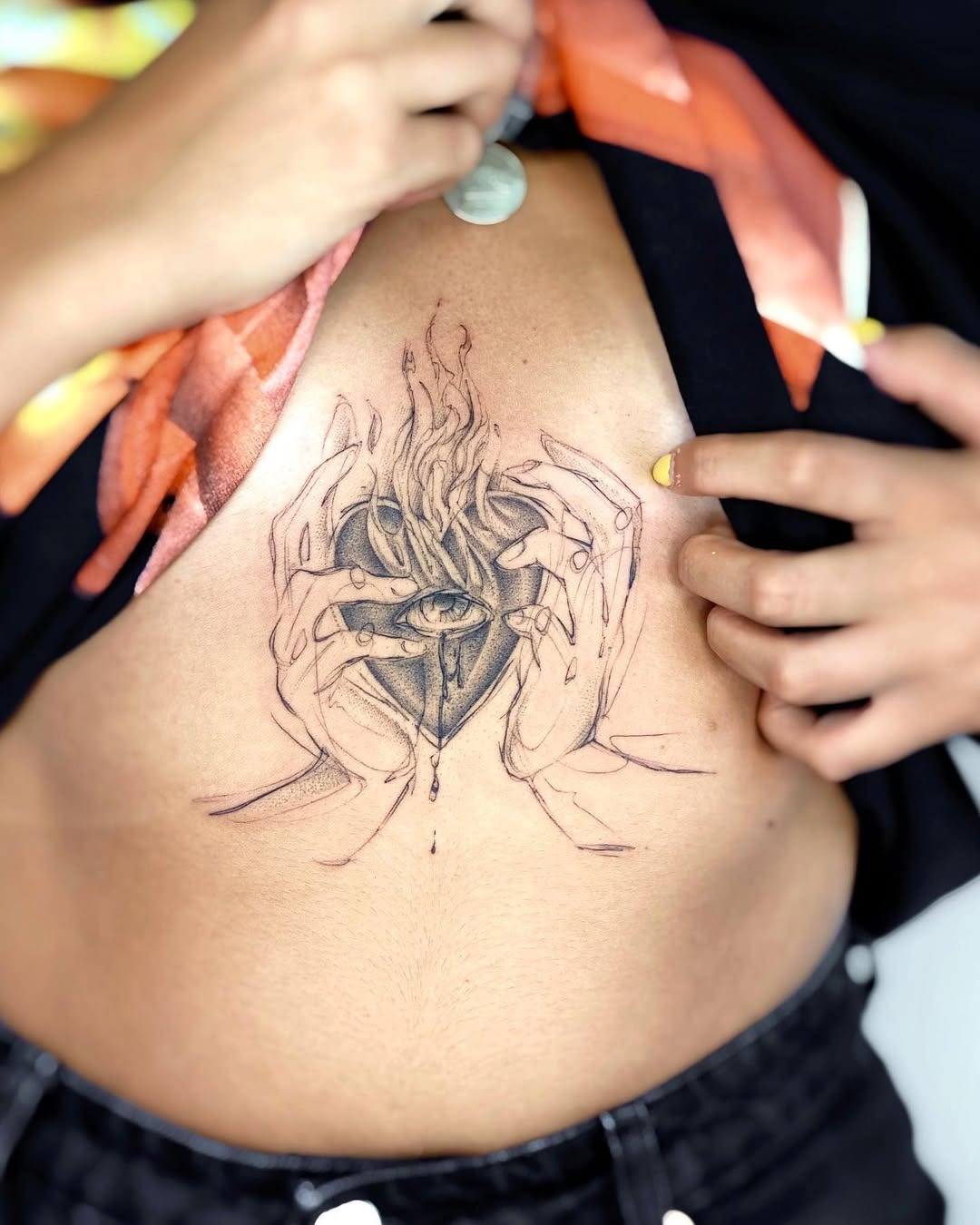 Artistic hands cradling a fiery heart tattoo Tattoo Design
