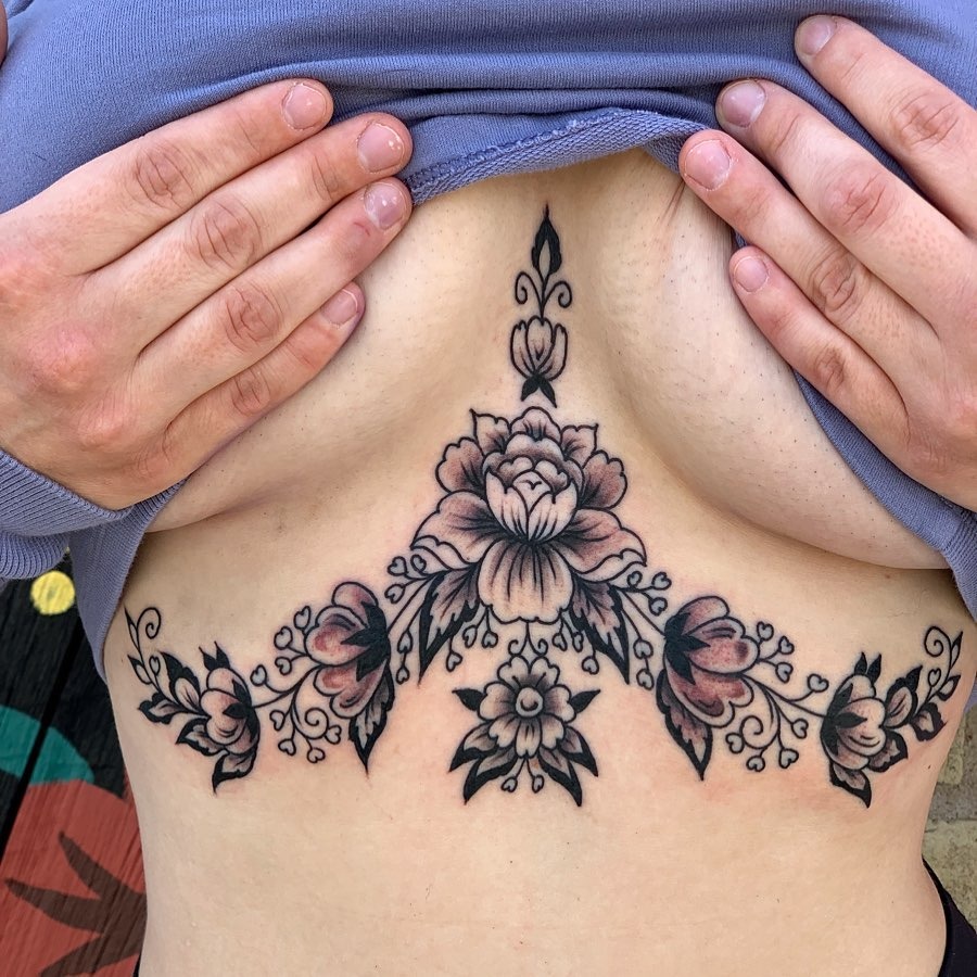 Elegant floral underboob tattoo with intricate details Tattoo Design