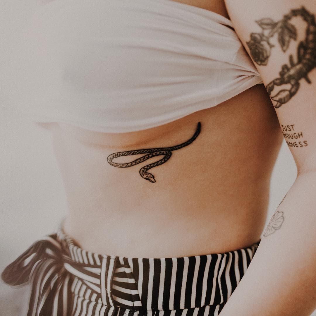 Elegant snake underboob tattoo design Tattoo Design