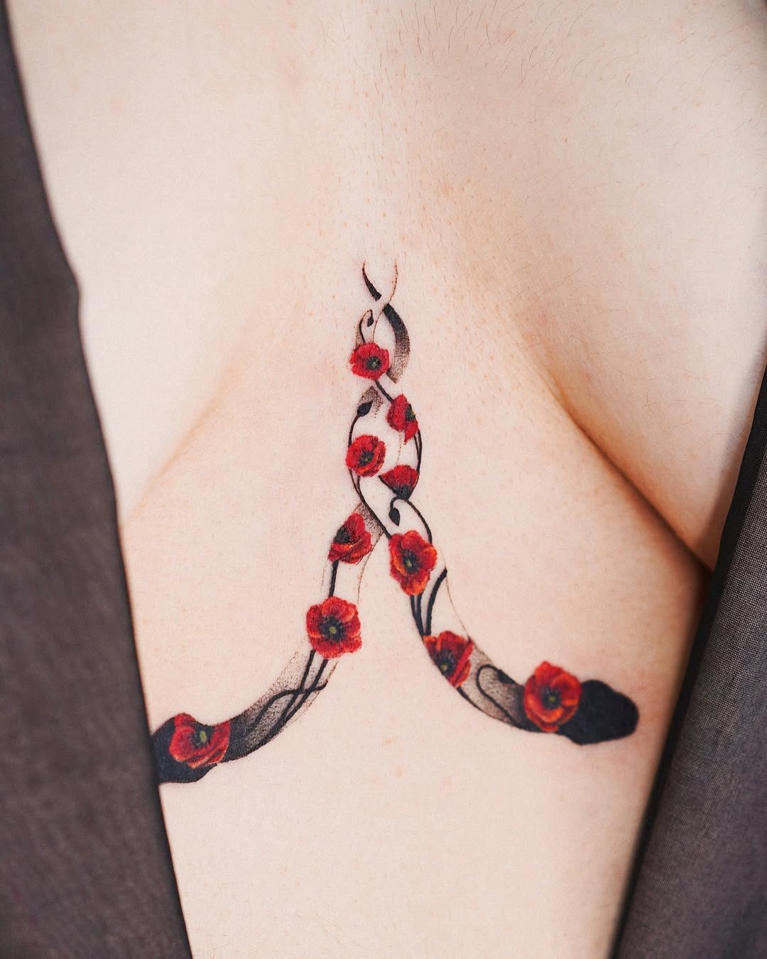 Elegant underboob tattoo with red roses Tattoo Design