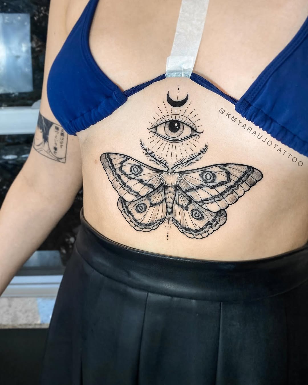 Intricate moth and eye underboob tattoo Tattoo Design