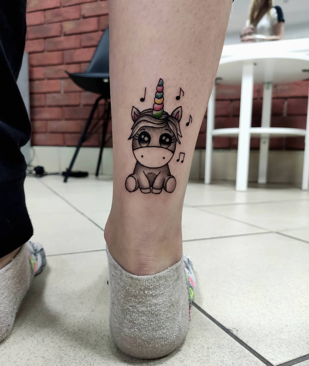 Adorable Unicorn Tattoo with Musical Notes Tattoo Design