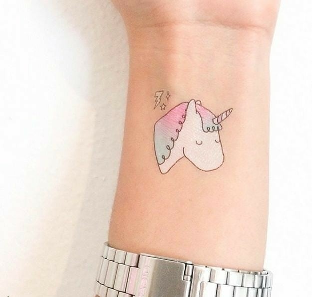 Charming unicorn tattoo with a playful design Tattoo Design