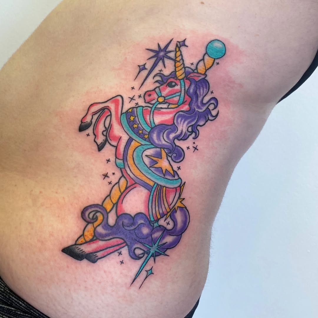 Colorful unicorn tattoo with whimsical details Tattoo Design