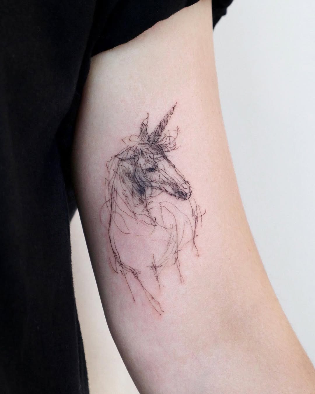 Elegant unicorn ink with delicate linework Tattoo Design
