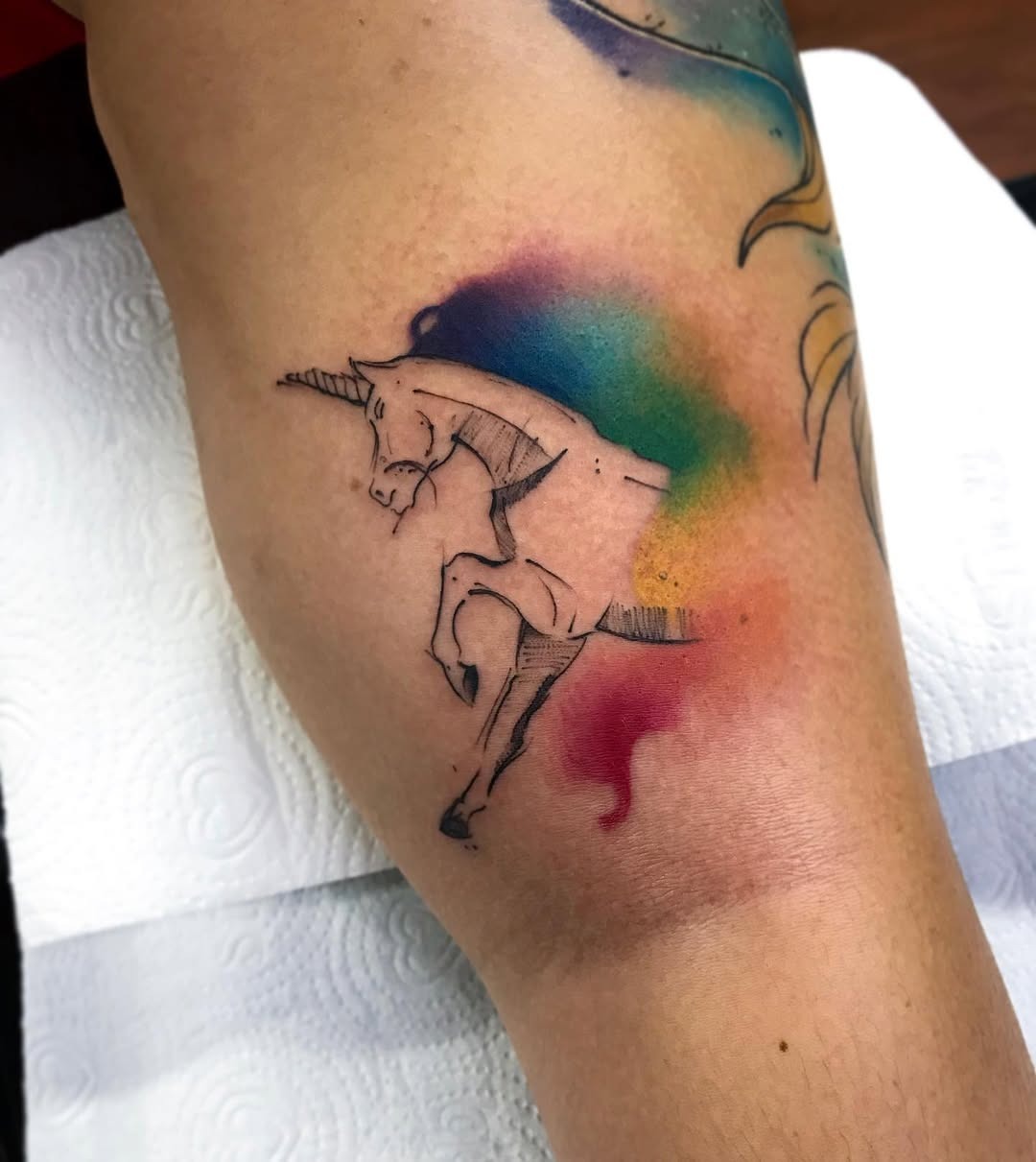 Magical unicorn tattoo with colorful splash Tattoo Design