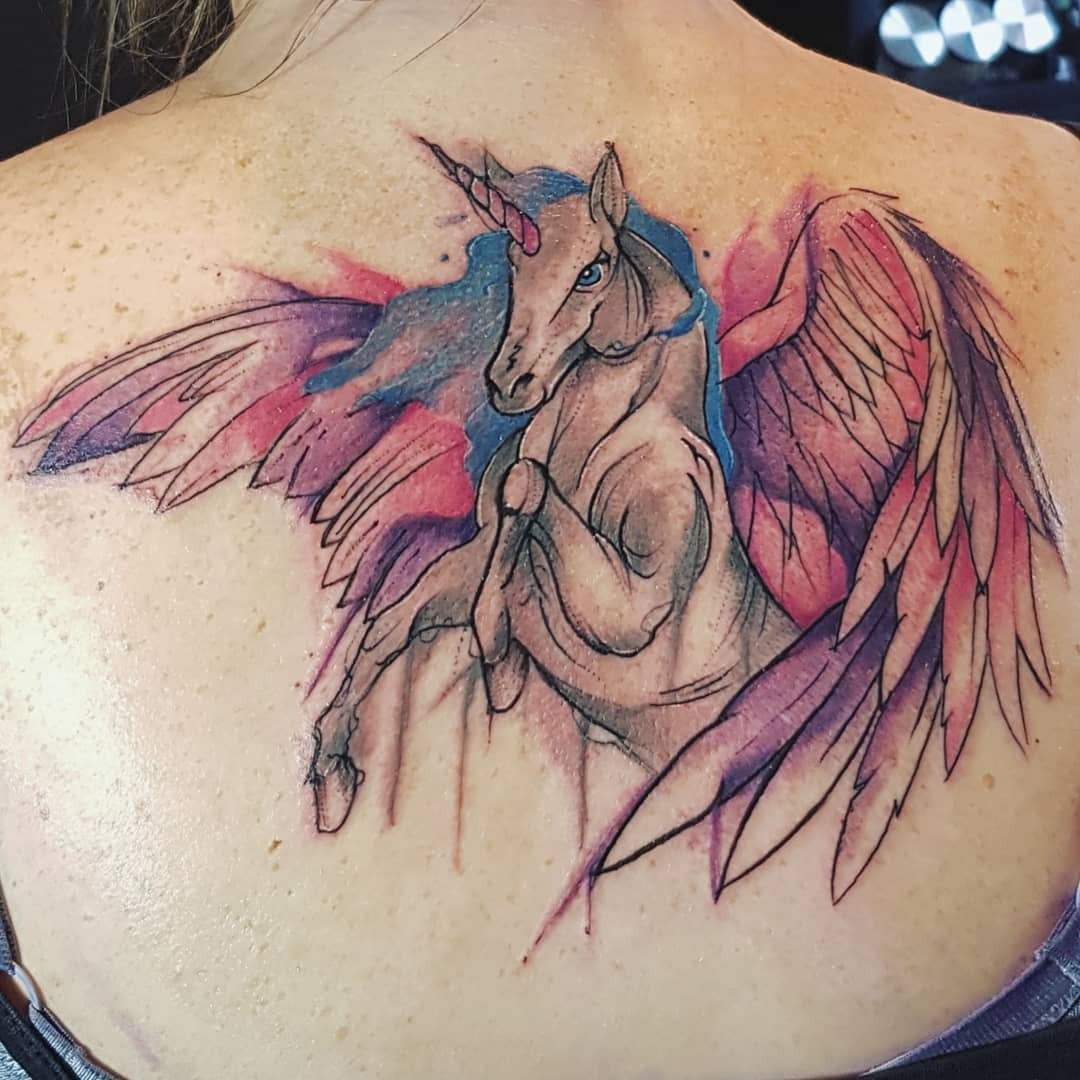Majestic unicorn tattoo with whimsical elements Tattoo Design