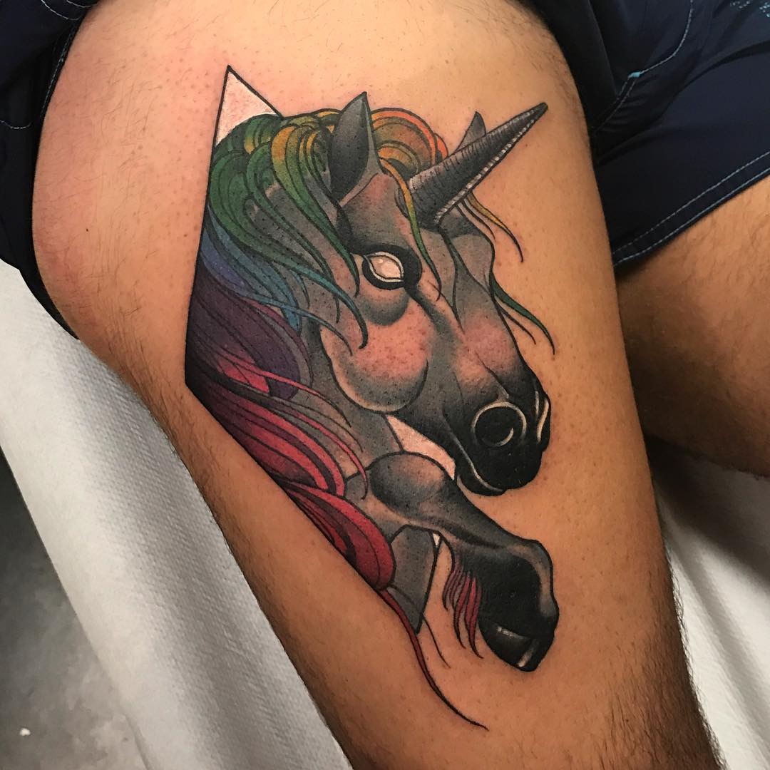 Vibrant unicorn tattoo with rainbow accents Tattoo Design