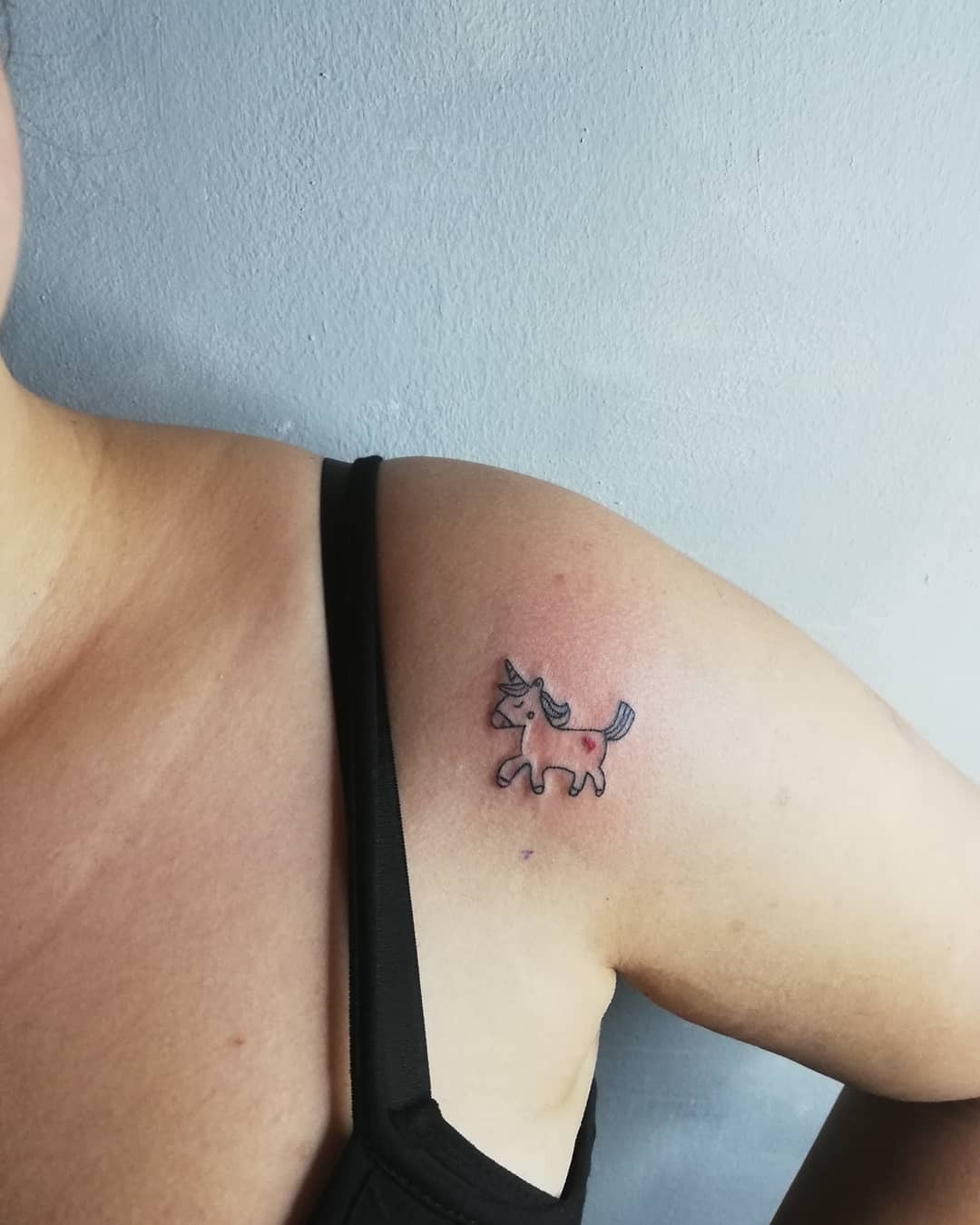 Whimsical unicorn tattoo on the shoulder Tattoo Design