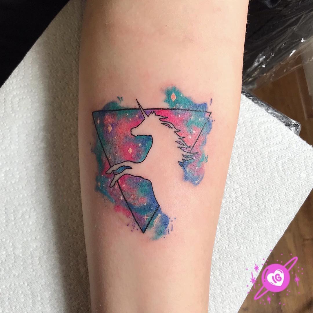Whimsical unicorn tattoo with galaxy aura Tattoo Design