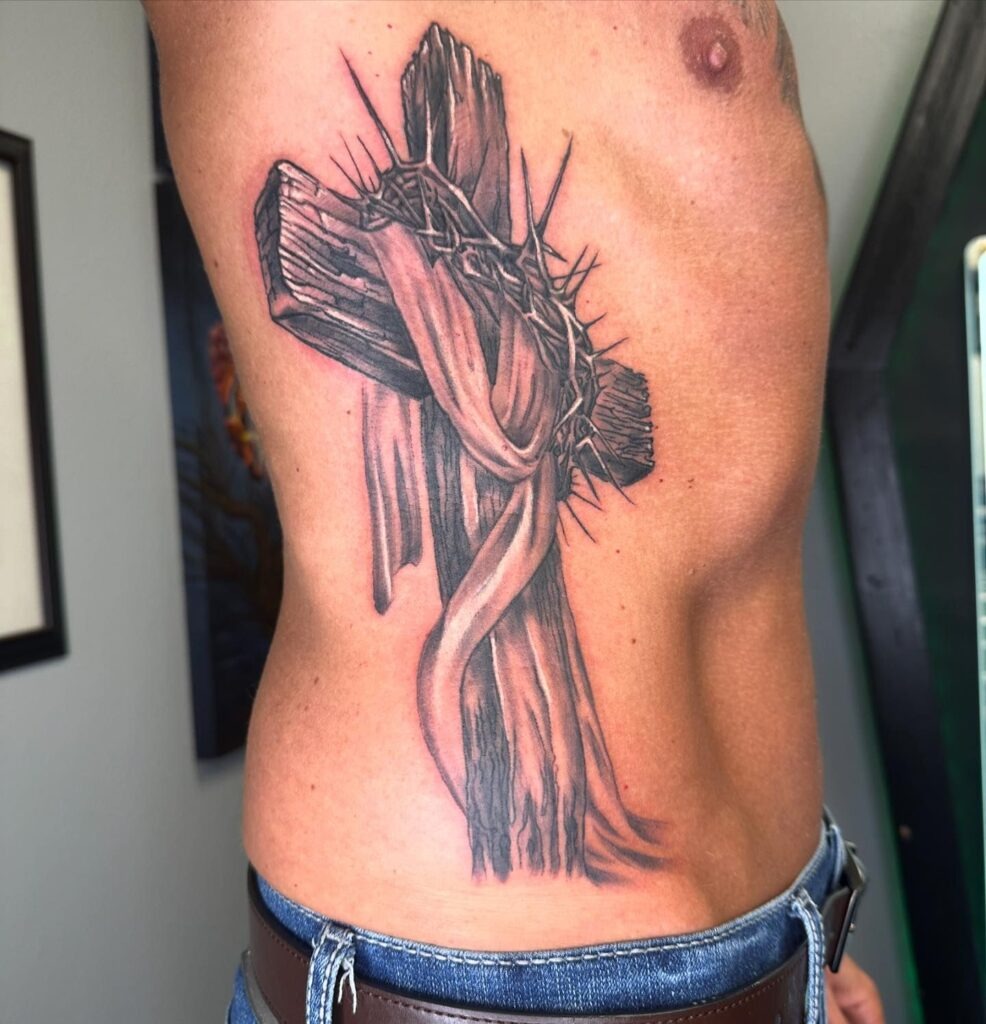 Crowned Cross with Radiating Light Arm Tattoo Tattoo Design