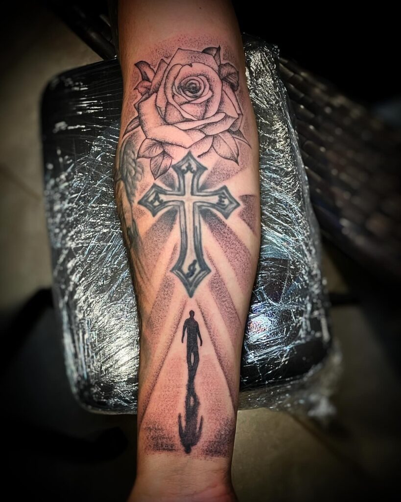 Hand Grasping Cross with Broken Chains Tattoo Tattoo Design