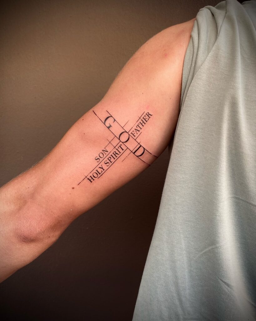 Minimalist Cross with "Fe" Behind the Ear Tattoo Tattoo Design