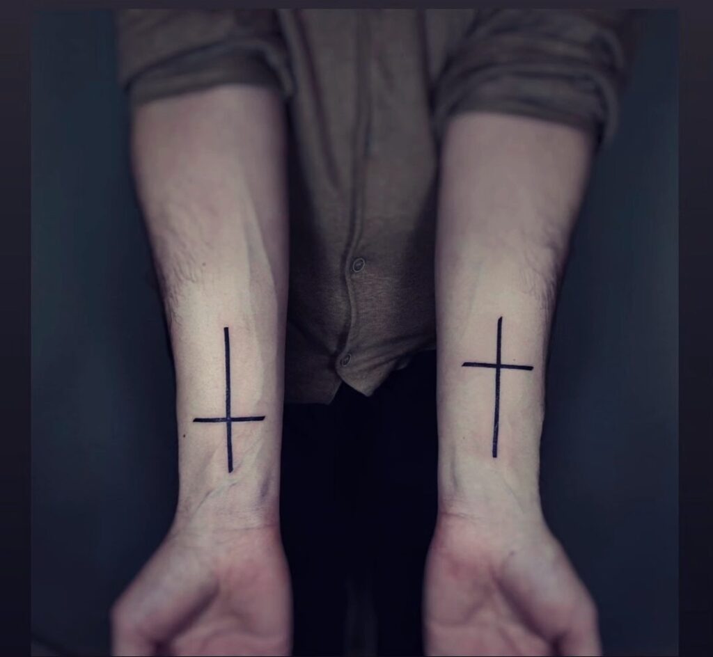 Nails Cross Tattoo on Upper Arm Tattoo Design